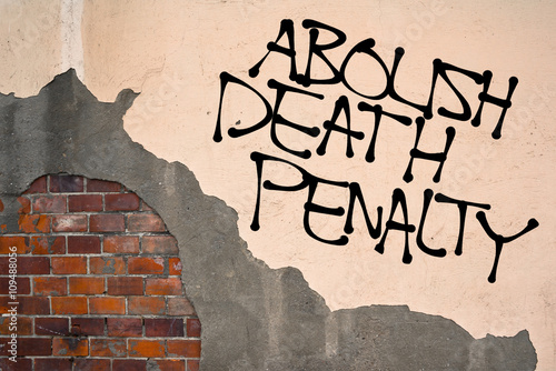 Handwritten graffiti Abolish Death Penalty sprayed on the wall ...