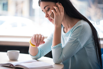 Pleasant woman sitting in the cafe 