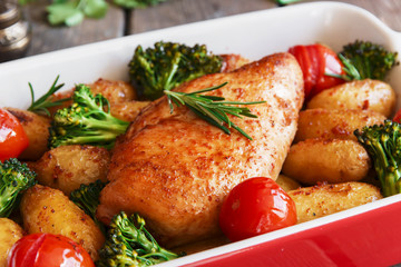 Chicken breast baked with tomato new potatoes and broccoli