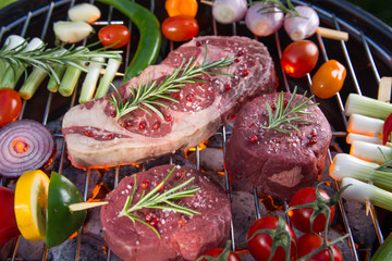 Delicious beef meat with vegetable on a barbecue grill.