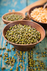 Raw legume on old rustic wooden table.