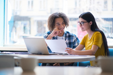 Nice colleagues sitting at the table  