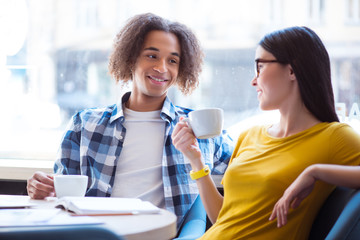 Nice couple sitting at the table 