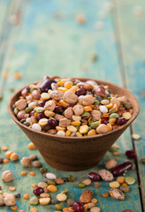 Raw legume on old rustic wooden table.