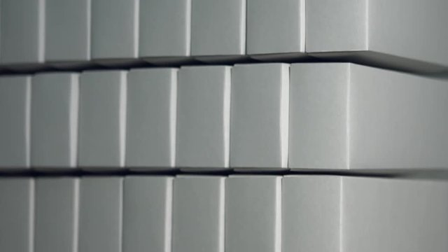 Simple white boxes. Rows of white paper boxes. Parcels for unknown recipient. Free delivery of cheap merchandise.