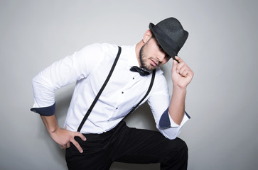 handsome young man with hat and wrist watch