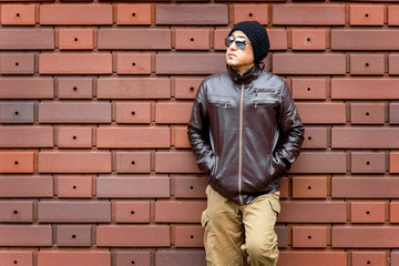 Fototapeta na wymiar An Asian Man in a Brown Jacket