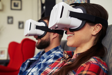 Close up of couple in virtual reality glasses that watching some