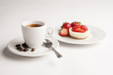 Cup of coffee with strawberry cheesecake