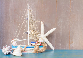 Seashells,  starfish and boat  with copy space