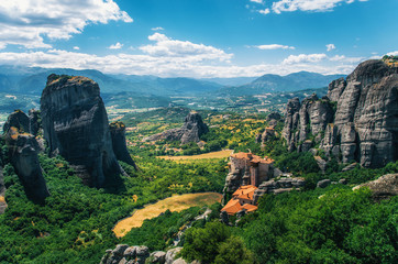 Obraz premium Meteora, Greece. Mountain scenery with Meteora rocks and Roussanou Monastery, landscape place of monasteries on the rocks, orthodox religious greek landmark in Thessaly