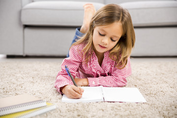 Little girl making homework