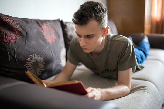 Teenager reading a book