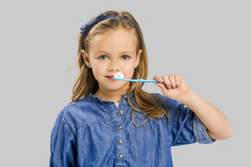 Little girl brushing teeth