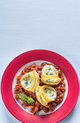 Lumaconi stuffed with ricotta with bolognese sauce
