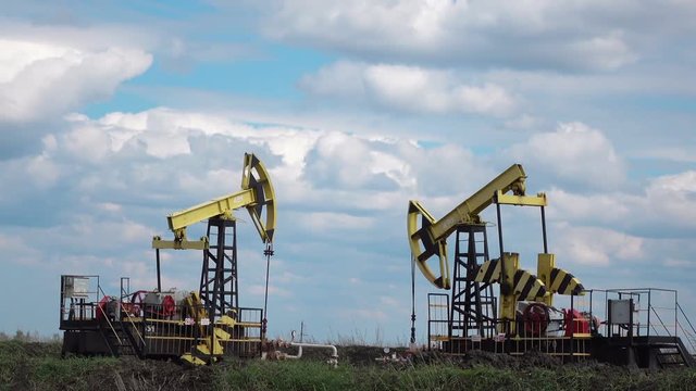 Working Oil Pump at blue sky zoom out Full hd video
