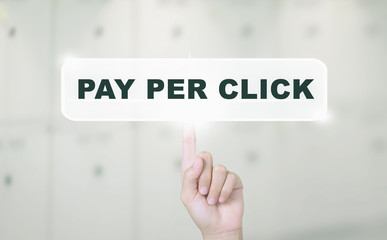Businessman hand touch screen on PAY PER CLICK message. Can be used for your ad. Vintage Tone.