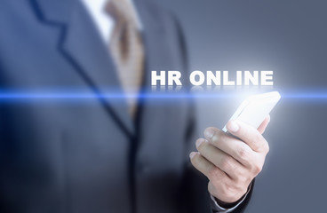 Businessman pressing hand HR Online message on virtual screen. Can bring to the medium of your ad.