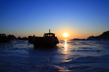 Fototapeta premium The silhouette of the sea fishing boats