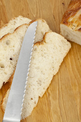 a knife slicing the bread