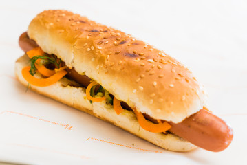 sausage in a sesame seed bun