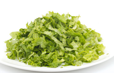 chopped lettuce leaves on a white background
