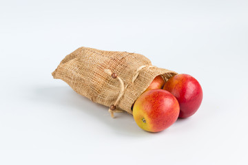 Apples in sack on white background