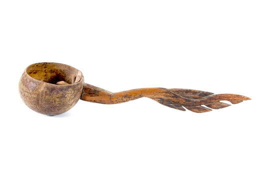 Dipper made from coconut shell with wood carving handle isolated