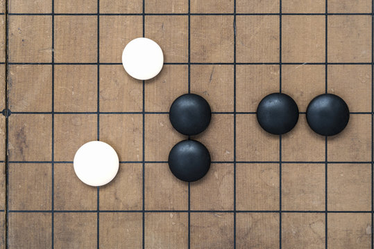Go game board. Weiqi game board. Stones on a Go board