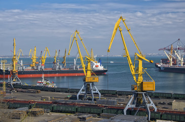 View of seaport harbor with cranes and industrial ships