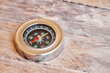 Compass on the wooden table