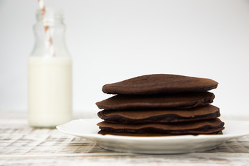 Fototapeta na wymiar Chocolate pancake on a light background