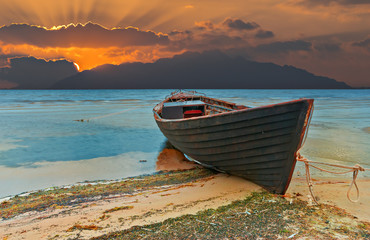 Coastal landscape with old fishing boat