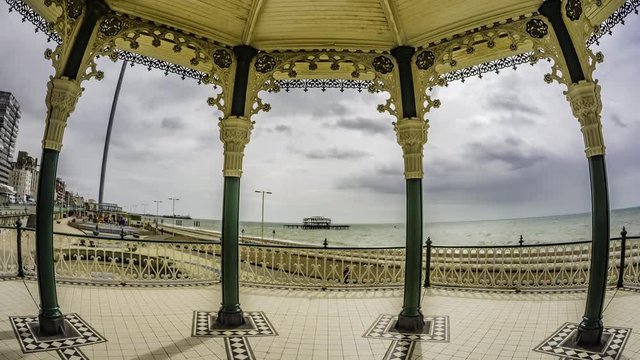 Time lapse fish eye view of the Victorian bandstand and the remains of the destroyed West pier in Brighton and Hove (UK)