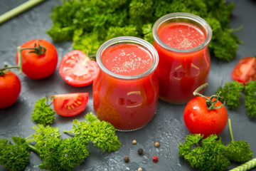 fresh organic tomatoes and tomato juice with parsley. the detox