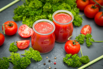 fresh organic tomatoes and tomato juice with parsley. the detox