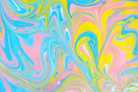 Abstract background. Ink marbling texture. Multicoloured. Hand drawn marble illustration, ebru aqua paper and silk print. Traditional Turkish ebru technique. Painting on water. 