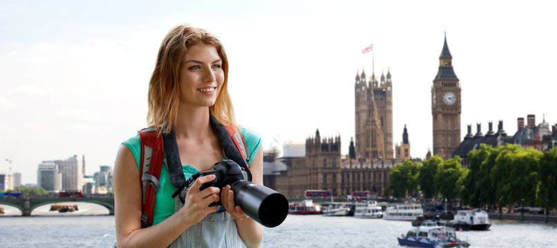 woman with backpack and camera over london big ben