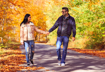 Happy young couple at first date taking a walk