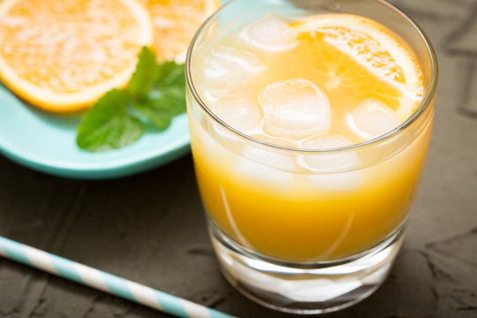 Orange juice in glass with mint, fresh fruits. selective focus,