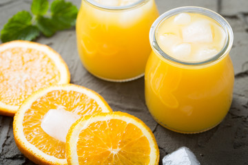Orange juice in glass with mint, fresh fruits. selective focus,