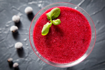 red smoothie with frozen berries, selective focus, top view. detox koncept