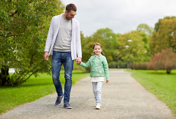 Obraz premium happy family walking in summer park