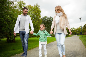 Naklejka na ściany i meble happy family walking in summer park