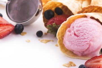 Strawberry ice cream scoops and wafer cones