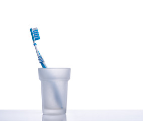 Toothbrush on a shelf with isolated background