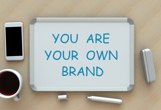 You Are Your Own Brand, message on whiteboard, smart phone and coffee on table, 3D rendering