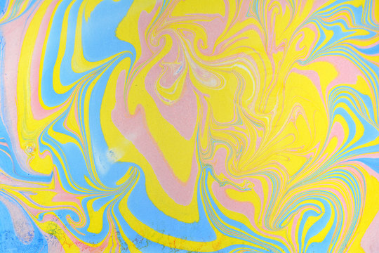 Abstract handmade marble background. Ebru, traditional Turkish painting art. Painting on water. Transferred painting on paper. Marbling style. Writing surface, endpapers in bookbinding and stationery.