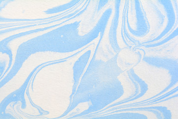 Watercolour stains, abstract background on paper, aqua print artistic effect. Cover design suminagashi art. Blue ink texture. Hand drawn marbling illustration technique.