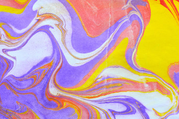 Close up view of an original ebru painting. Abstract bright grunge background. Multicolored paper texture with space for text or image. Fragment of artwork, modern art, contemporary art. Turkish art.